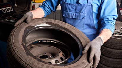 Defective product attorney inspecting tire